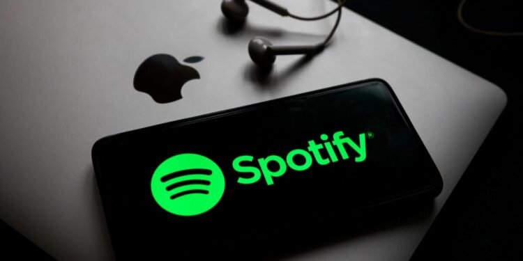 Spotify’s U.S. App Update Approved by Apple Amid Antitrust Shift 1 Spotify US app update, Spotify Apple App Store, Spotify external payment links, Spotify pricing information, Apple App Store policy, Spotify antitrust, Spotify subscription pricing, Spotify Apple approval, Spotify app update purchase links, Apple commission, Off-app purchases, Judge Yvonne Gonzalez Rogers, Epic Games lawsuit, Apple Music competition, Spotify annual profit, Streaming service, Music app, Spotify US app update shows pricing and external links, Apple approves Spotify app update with purchase link option, Spotify circumvents Apple App Store commission with new update, How to purchase Spotify subscription outside the Apple App Store, Impact of Apple's App Store policy change on Spotify, Spotify gains Apple approval after antitrust ruling, Spotify vs Apple App Store fees,