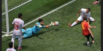 FIFA World Cup 2026, Alireza Beiranvand, Beiranvand save vs Belgium, Iran vs Belgium World Cup 2026, FIFA World Cup Moment of the Day, Iran football team, World Cup 2026 highlights, Kevin De Bruyne, Romelu Lukaku, Maxim De Cuyper, Iran unbeaten World Cup 2026, Best World Cup saves, Save of the tournament, FIFA World Cup news, Iran knockout qualification, Beiranvand World Cup heroics, World Cup goalkeeping moments, Belgium vs Iran draw, ESPN India World Cup, Football World Cup 2026 news,